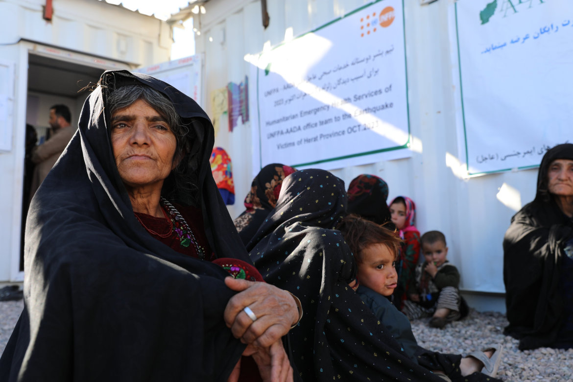 Women and children wait for UN-provided medical care. (UNFPA)
